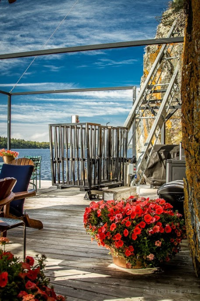 Classic Hoist open cage at a dock landing with the track climbing the rock face