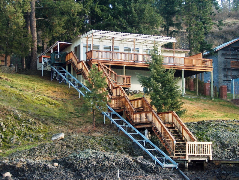 Classic Hoist track beside the stair run from house to shore, carriage at the top